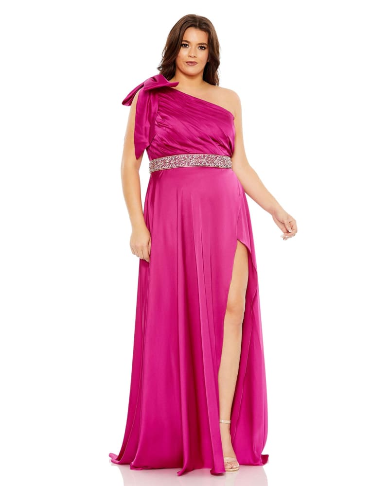 Front of a model wearing a size 14W Bow One Shoulder Faux Wrap Gown in Fuchsia by Mac Duggal. | dia_product_style_image_id:289952